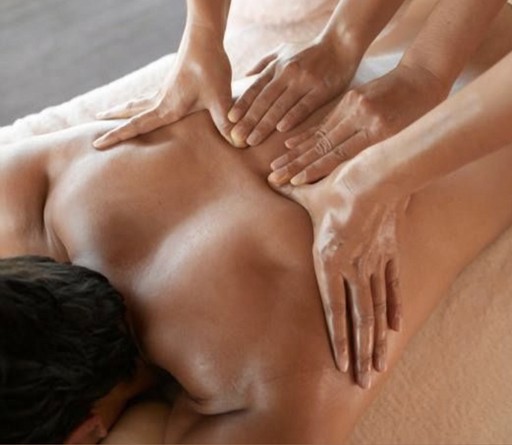 Synchronized four-hands back massage, deep relaxation technique